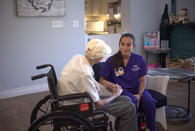 Harris College nursing students working with memory care residents at local senior living center